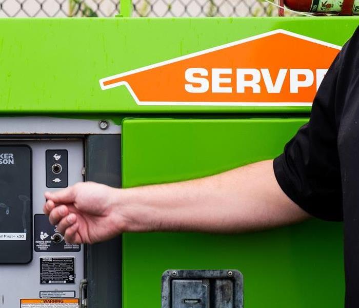 SERVPRO expert turning on switch